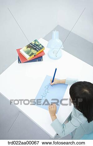 A girl writing 'Happy' on the blue paper with a blue colored pencil View Large Photo Image Stock Photo - A girl writing 'Happy' on the blue paper with a blue colored pencil. Fotosearch