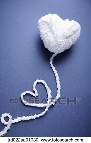 A heart shaped ball of white wool with a heart shaped yarn out of it View Large Photo Image Stock Image - A heart shaped ball of white wool with a heart shaped yarn out of it. Fotosearch