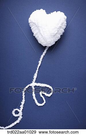 A heart shaped ball of white wool with a heart shaped yarn out of it View Large Photo Image Stock Photo - A heart shaped ball of white wool with a heart shaped yarn out of it. Fotosearch