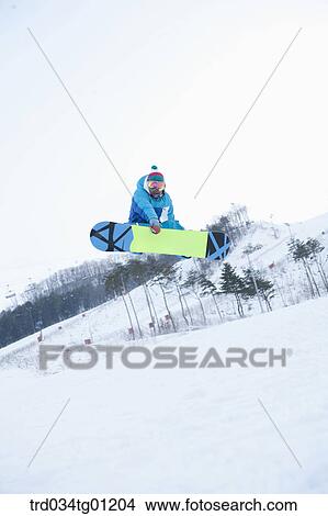 A man jumping on the snowboard View Large Photo Image Picture - A man jumping on the snowboard. Fotosearch