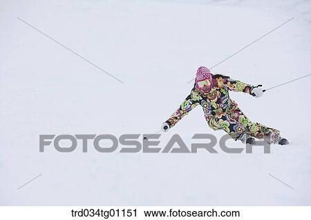 Stock Image - A man skiing on the slope . Fotosearch
