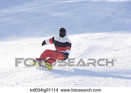 A man snowboarding on the slope View Large Photo Image Picture - A man snowboarding on the slope. Fotosearch