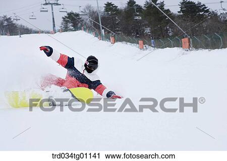 A man snowboarding on the slope View Large Photo Image Stock Image - A man snowboarding on the slope. Fotosearch