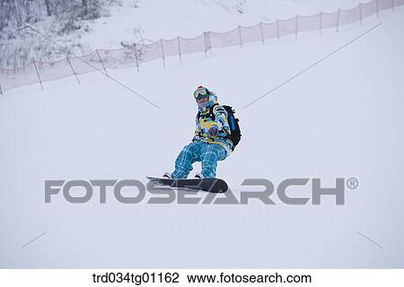A man snowboarding on the slope View Large Photo Image Stock Image - A man snowboarding on the slope. Fotosearch