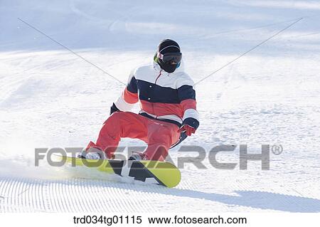 A man snowboarding on the slope View Large Photo Image Stock Photography - A man snowboarding on the slope. Fotosearch