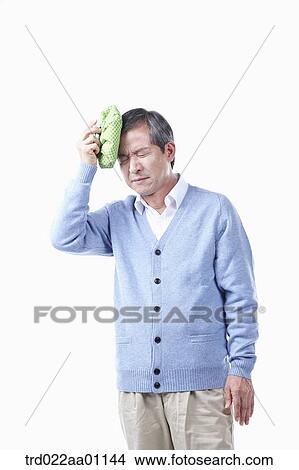 A painful elderly man with headache View Large Photo Image Picture - A painful elderly man with headache . Fotosearch