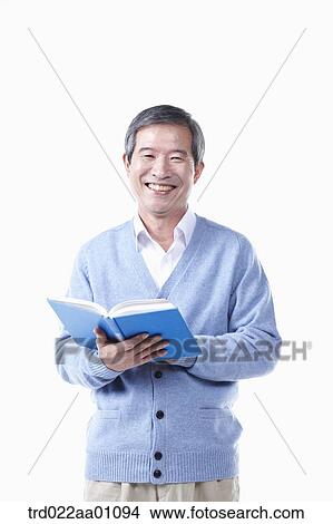 Picture - A smiling elderly man with a book. Fotosearch