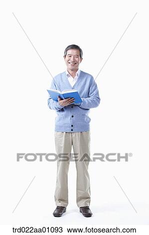 A smiling elderly man with a book View Large Photo Image Stock Image - A smiling elderly man with a book. Fotosearch