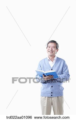 A smiling elderly man with a book View Large Photo Image Stock Photograph - A smiling elderly man with a book. Fotosearch