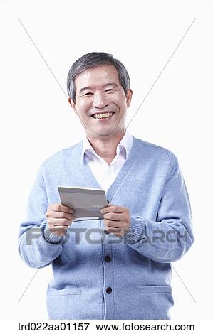 Stock Photo - A smiling elderly man with the bankbook. Fotosearch