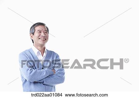 A standing elderly man with his arms folded View Large Photo Image Picture - A standing elderly man with his arms folded. Fotosearch