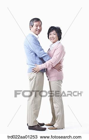 An elderly man and woman having arms around each other View Large Photo Image Stock Image - An elderly man and woman having arms around each other. Fotosearch