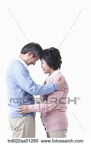 An elderly man and woman having arms around each other View Large Photo Image Stock Image - An elderly man and woman having arms around each other. Fotosearch