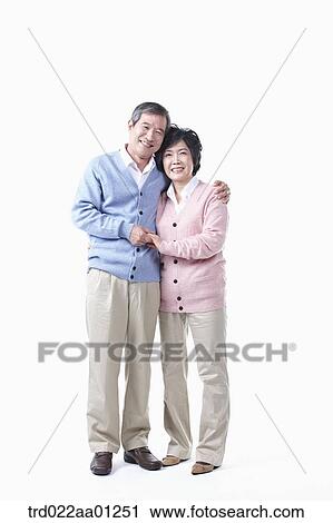 An elderly man and woman holding hands together View Large Photo Image Stock Image - An elderly man and woman holding hands together. Fotosearch