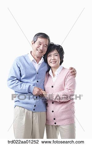 An elderly man and woman holding hands together View Large Photo Image Stock Image - An elderly man and woman holding hands together. Fotosearch