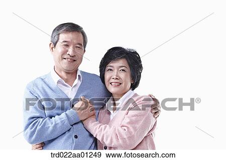 An elderly man and woman holding hands together View Large Photo Image Stock Photo - An elderly man and woman holding hands together. Fotosearch