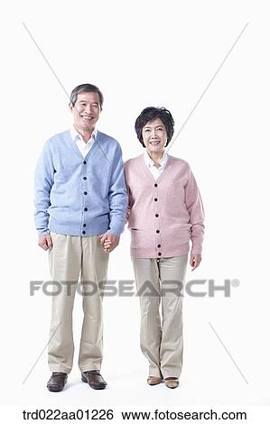 An elderly man and woman holding hands together View Large Photo Image Stock Photograph - An elderly man and woman holding hands together. Fotosearch