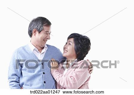 An elderly man and woman smiling at each other View Large Photo Image Stock Photo - An elderly man and woman smiling at each other . Fotosearch