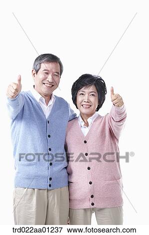 An elderly man and woman with the thumbs up View Large Photo Image Stock Photo - An elderly man and woman with the thumbs up . Fotosearch
