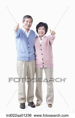 An elderly man and woman with the thumbs up View Large Photo Image Stock Photograph - An elderly man and woman with the thumbs up . Fotosearch