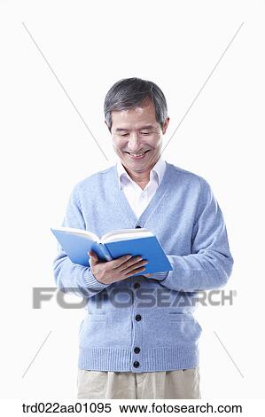 An elderly man reading a book View Large Photo Image Stock Photography - An elderly man reading a book. Fotosearch
