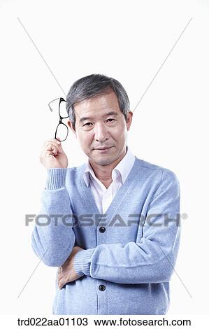An elderly man with the glasses on his head View Large Photo Image Stock Image - An elderly man with the glasses on his head . Fotosearch