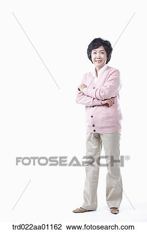 An elderly woman with her arms folded View Large Photo Image Stock Image - An elderly woman with her arms folded. Fotosearch