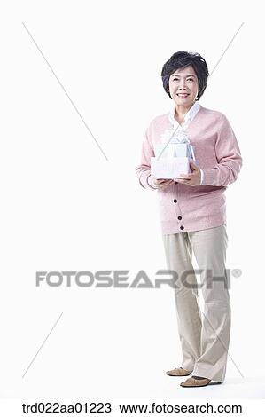 An elderly woman with the gift View Large Photo Image Stock Image - An elderly woman with the gift. Fotosearch