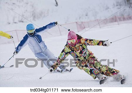 People skiing on the slope View Large Photo Image Stock Image - People skiing on the slope . Fotosearch
