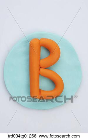 The alphabet B shaped orange clay on the blue circle clay View Large Photo Image Stock Photograph - The alphabet B shaped orange clay on the blue circle clay . Fotosearch