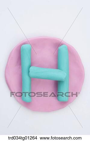 The alphabet H shaped blue clay on the pink circle clay View Large Photo Image Picture - The alphabet H shaped blue clay on the pink circle clay . Fotosearch