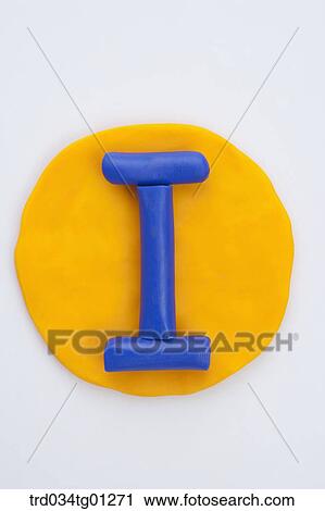 Stock Image - The alphabet I shaped blue clay on the yellow circle clay . Fotosearch
