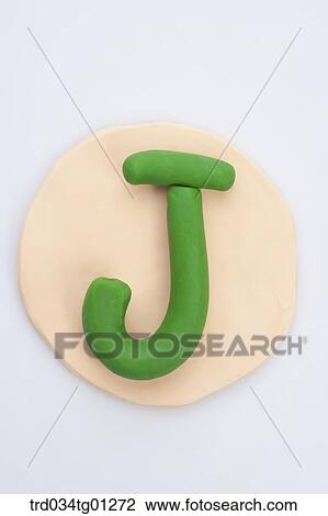 The alphabet J shaped green clay on the orange circle clay View Large Photo Image Stock Image - The alphabet J shaped green clay on the orange circle clay . Fotosearch