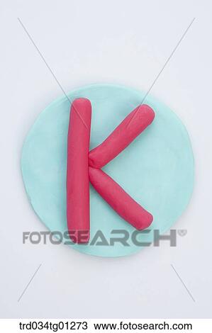 The alphabet K shaped pink clay on the blue circle clay View Large Photo Image Stock Image - The alphabet K shaped pink clay on the blue circle clay . Fotosearch