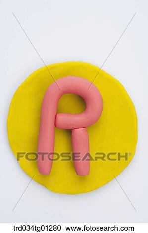 The alphabet R shaped orange clay on the yellow circle clay View Large Photo Image Stock Image - The alphabet R shaped orange clay on the yellow circle clay . Fotosearch