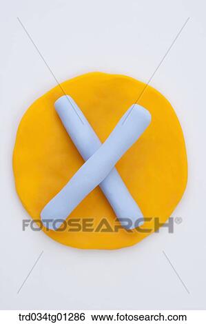The alphabet X shaped blue clay on the yellow circle clay View Large Photo Image Stock Photograph - The alphabet X shaped blue clay on the yellow circle clay . Fotosearch
