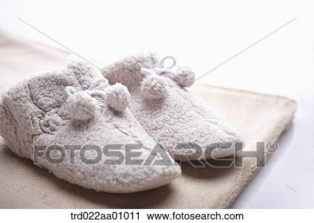 The baby fur socks on brown rug View Large Photo Image Stock Image - The baby fur socks on brown rug. Fotosearch