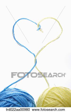 The balls of blue and yellow wool making the heart View Large Photo Image Stock Image - The balls of blue and yellow wool making the heart . Fotosearch