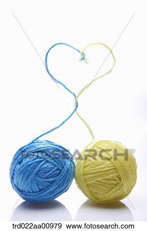 The balls of blue and yellow wool making the heart View Large Photo Image Stock Photo - The balls of blue and yellow wool making the heart . Fotosearch