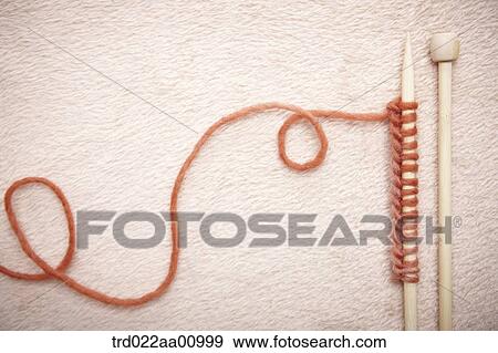 The brown wool knitting needles View Large Photo Image Stock Photo - The brown wool knitting needles. Fotosearch
