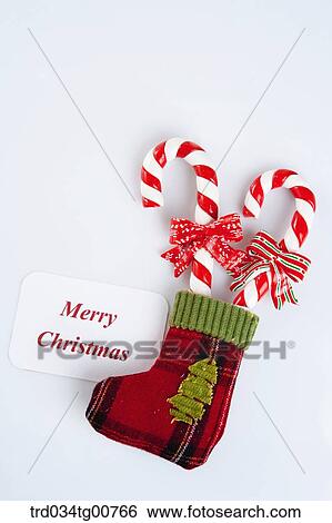 The canes in red sock and Merry Christmas note View Large Photo Image Stock Photograph - The canes in red sock and Merry Christmas note. Fotosearch