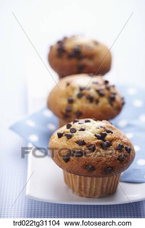 The chocolate chip muffin served on the dish View Large Photo Image Picture - The chocolate chip muffin served on the dish. Fotosearch