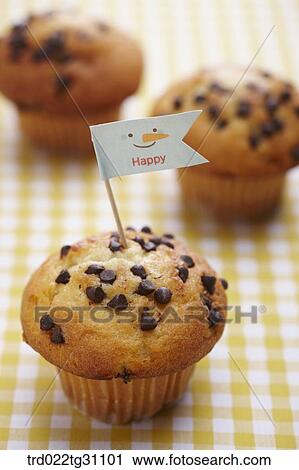 Stock Image - The chocolate chip muffin with the happy flag. Fotosearch