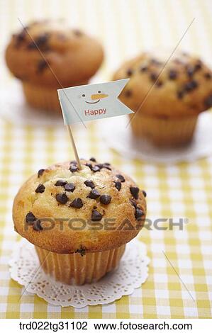 The chocolate chip muffin with the happy flag View Large Photo Image Stock Image - The chocolate chip muffin with the happy flag. Fotosearch