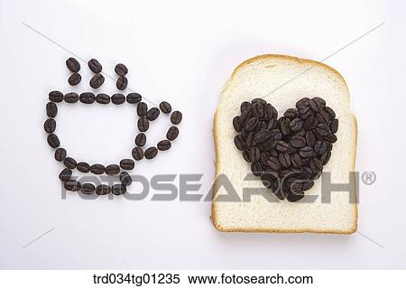 The coffee cup shape of coffee bean and the heart shape of coffee bean on the bread View Large Photo Image Stock Photography - The coffee cup shape of coffee bean and the heart shape of coffee bean on the bread. Fotosearch