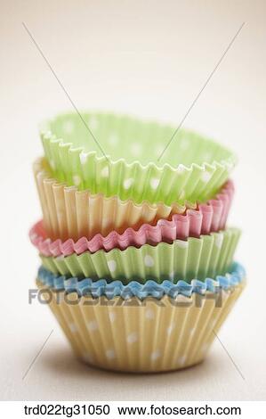 Stock Image - The colorful polka dots patterned baking cups. Fotosearch
