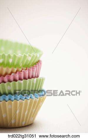 Stock Image - The colorful polka dots patterned baking cups. Fotosearch