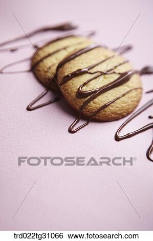The cookies with the chocolate syrup on them View Large Photo Image Stock Photograph - The cookies with the chocolate syrup on them . Fotosearch