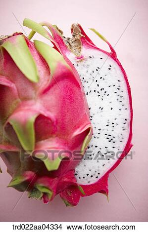 The dragon fruit in half with the pink background View Large Photo Image Picture - The dragon fruit in half with the pink background. Fotosearch