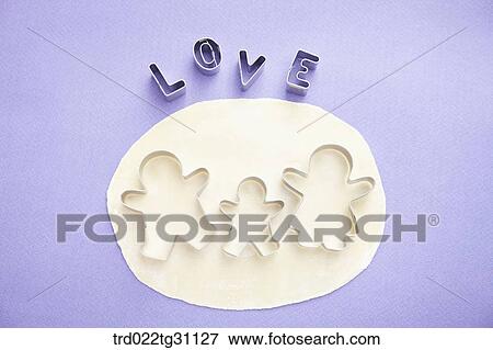 The family shaped cookie cutters on the dough and the love shaped cookie cutters View Large Photo Image Stock Photo - The family shaped cookie cutters on the dough and the love shaped cookie cutters. Fotosearch